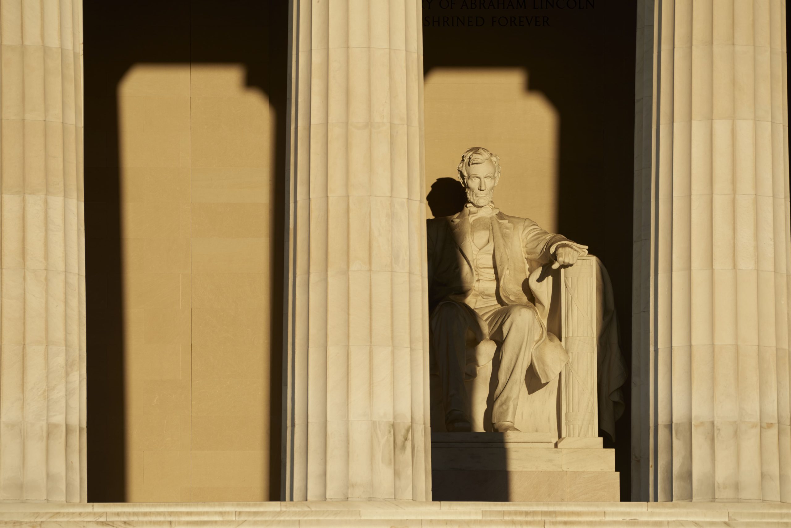 Abraham Lincoln delivering a speech during the Civil War, symbolizing the era's political tensions and the president's leadership amidst the conflict.