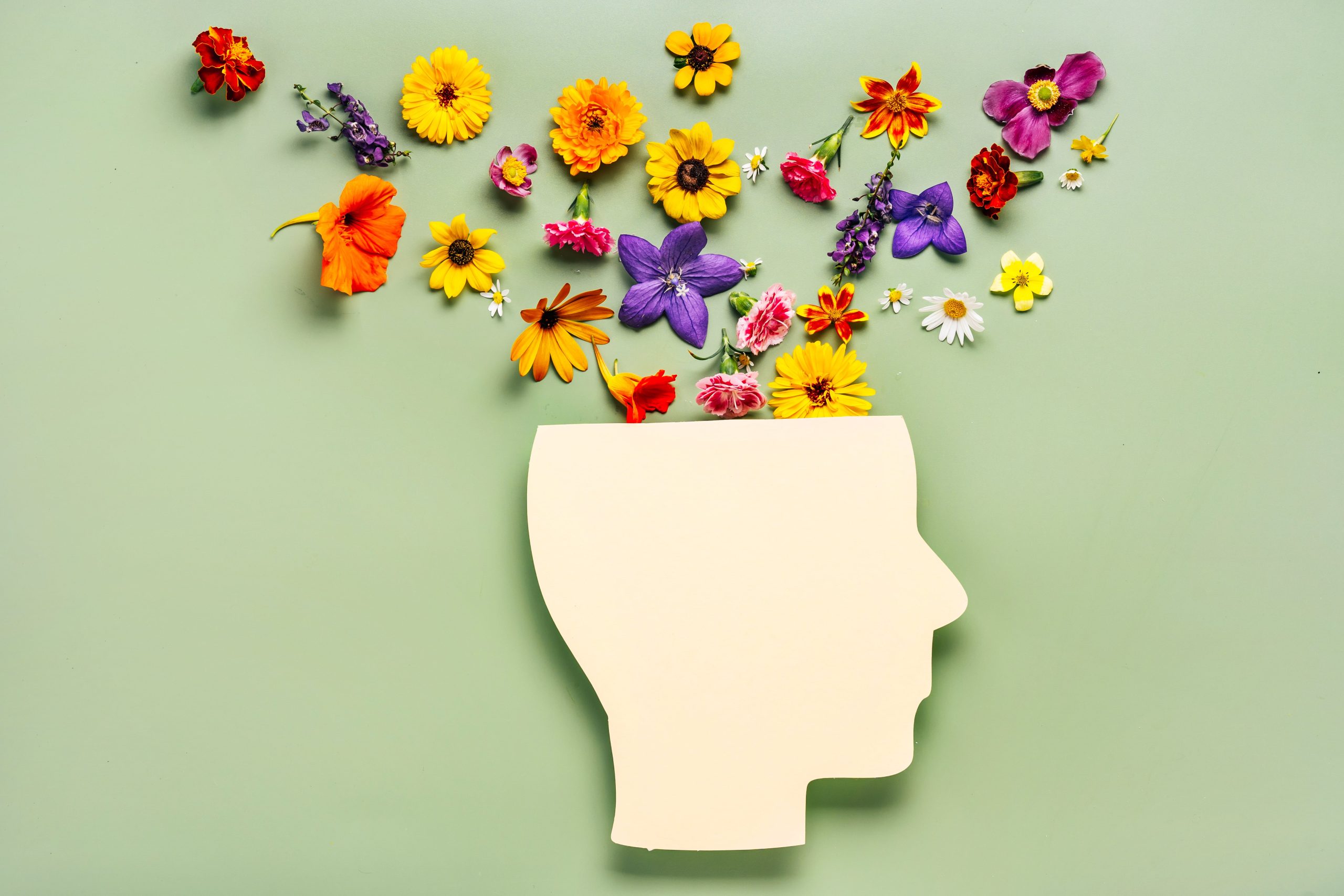 Illustration of a diverse group of employees in a workplace setting, engaging in open communication and wellness activities to support mental health