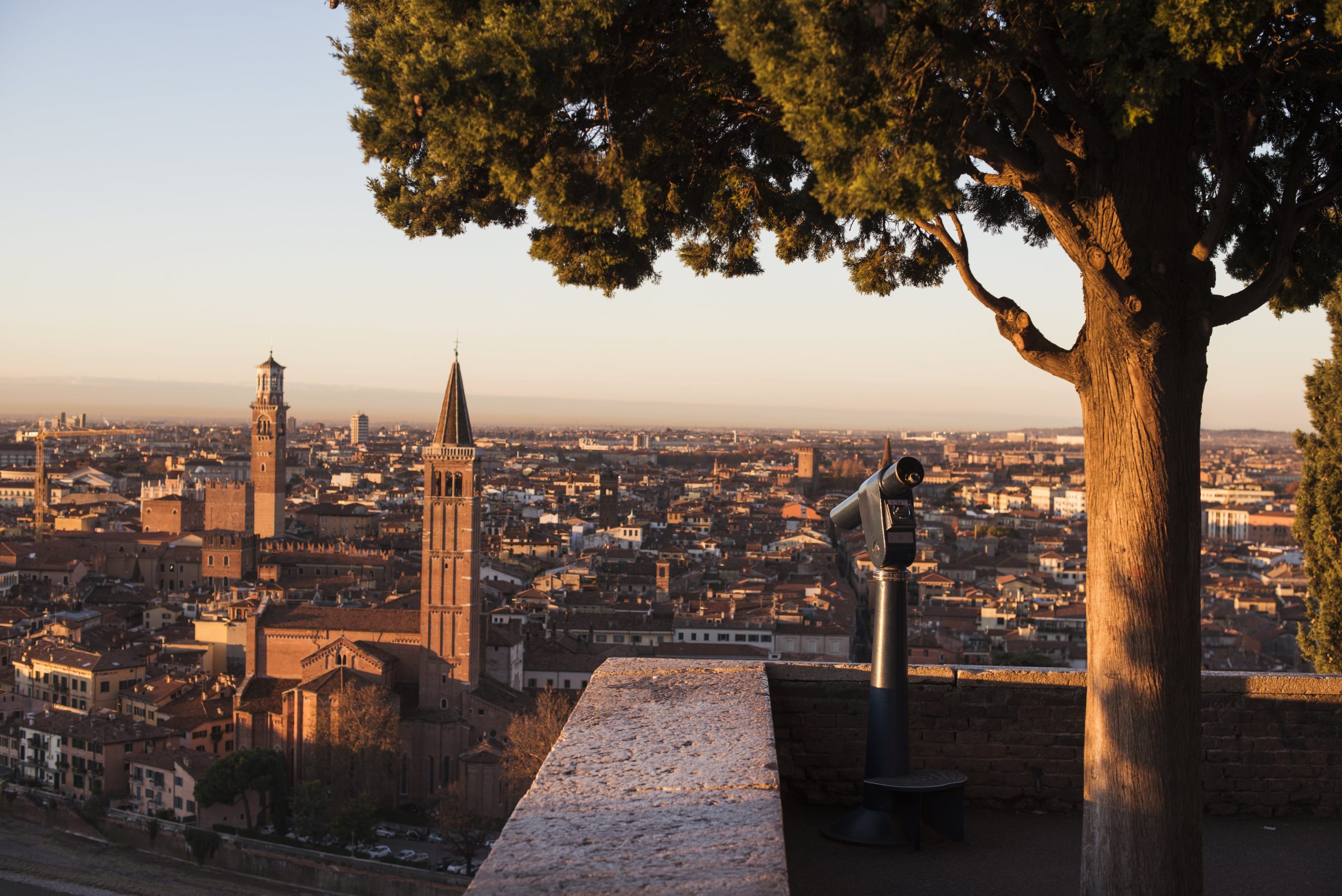 A scenic view of an Italian city with historic architecture and vibrant streets.
